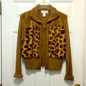 Leather and knit jacket with faux fur detail.